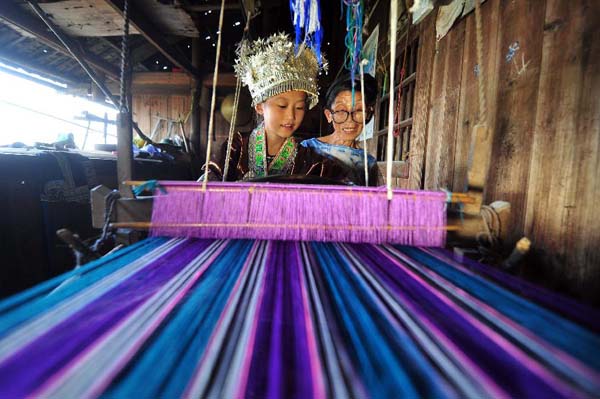 Girls learn traditional weaving in Rongshui, China's Guangxi