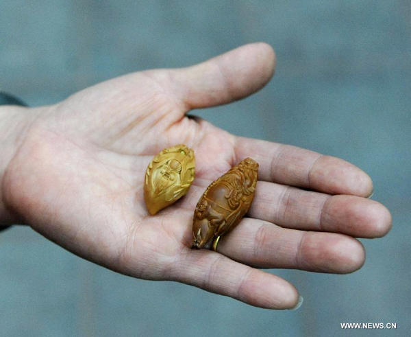 Walnut sculpture village in N China