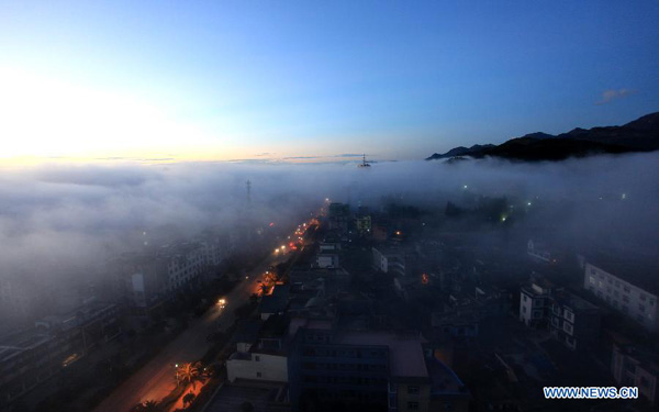 Cloud-blanketed Luoping county in SW China's Yunnan