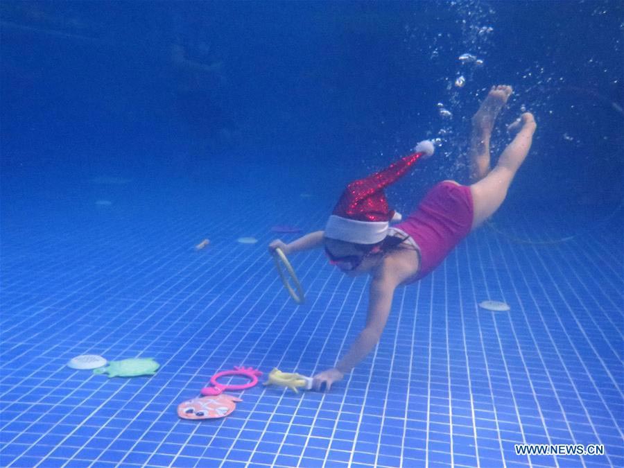 Babies in Beijing's Christmas swimming party