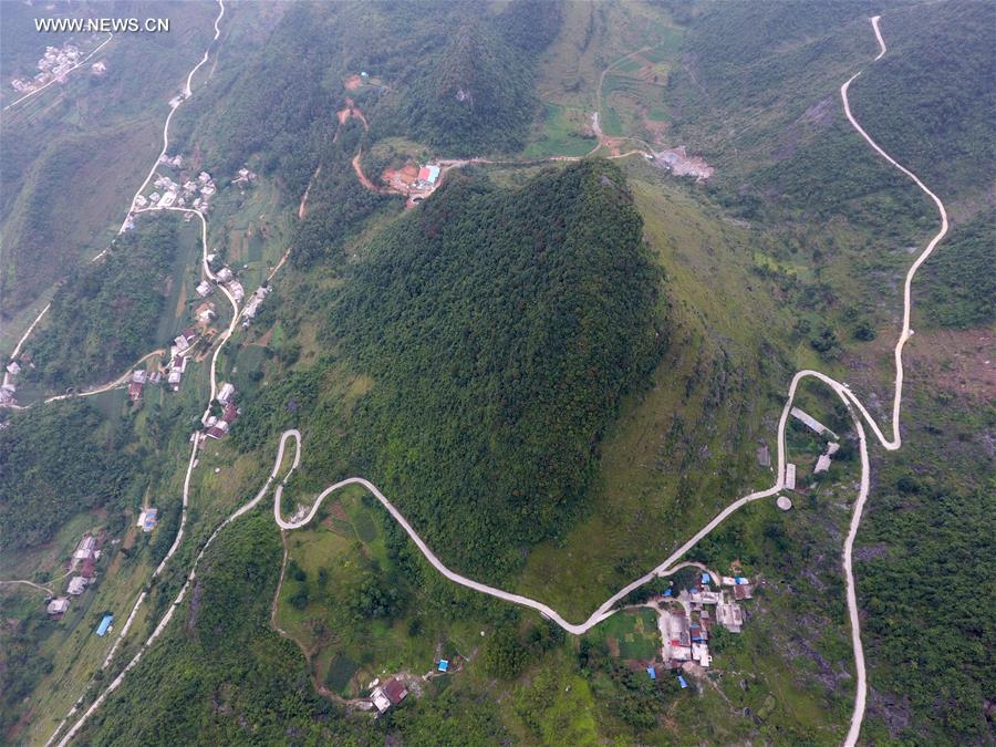 Counstruction of country roads help people to alleviate poverty in Guangxi