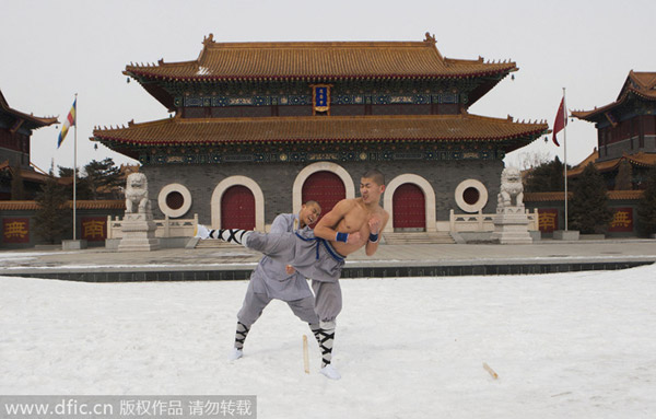 Buddhist monks break bricks in kung fu