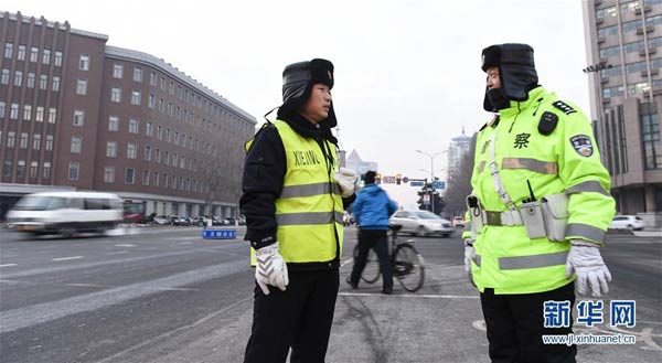 NE China police sticks to the job on a freezing cold day