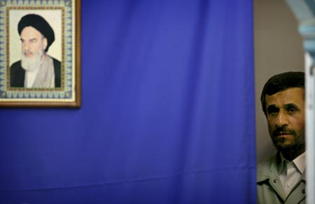 Iran's President Mahmoud Ahmadinejad waits to speak at Friday prayers at a university in Tehran October 20, 2006. 