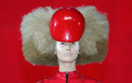 A model presents a creation during the OCM Hairworld gala show in Moscow's Kremlin July 4, 2006. 