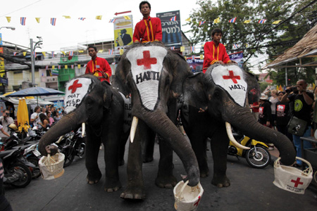 Thai elephants help collect money for Haiti