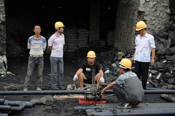 21 coal miners trapped underground in SW China