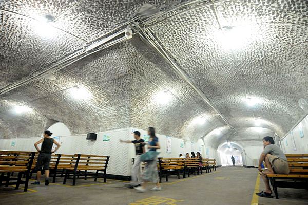 People cool off in air raid shelters