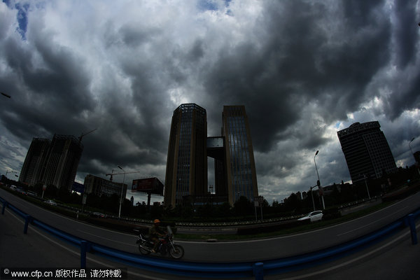 Thick clouds shield city from scorching sun