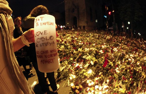 Sea of flowers marks vigil for twin attack victims