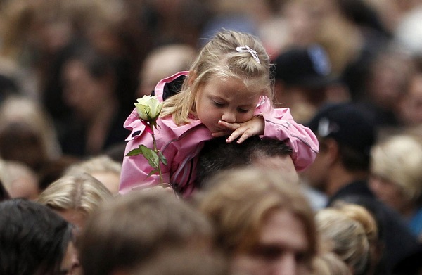 Sea of flowers marks vigil for twin attack victims