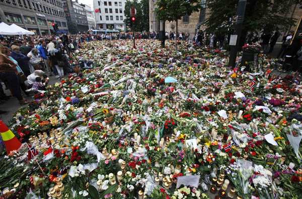 Sea of flowers marks vigil for twin attack victims