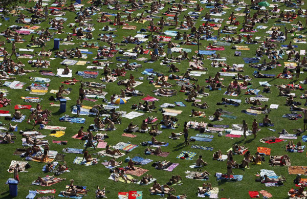 People out for sunbath in Prague