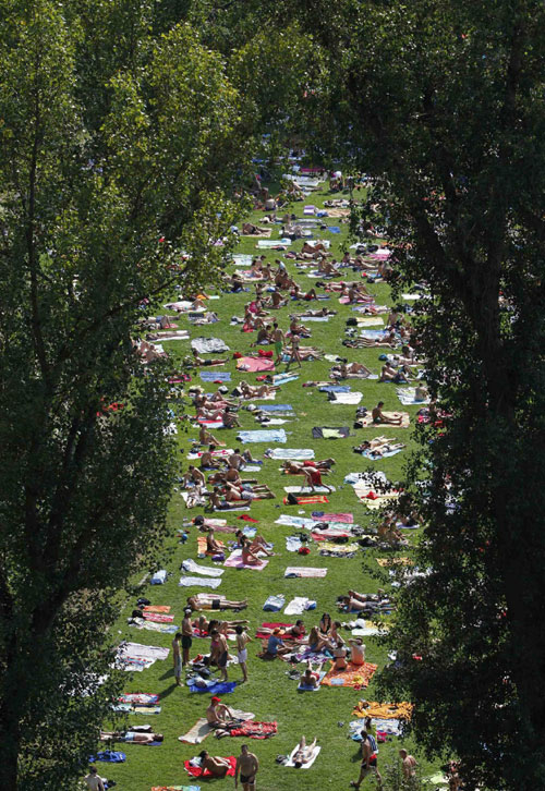 People out for sunbath in Prague