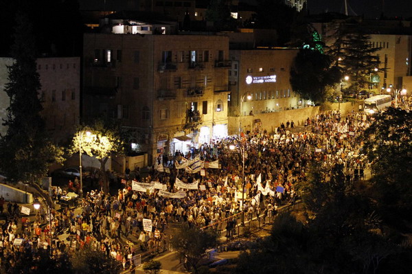 Biggest rally in Israel's history presses PM