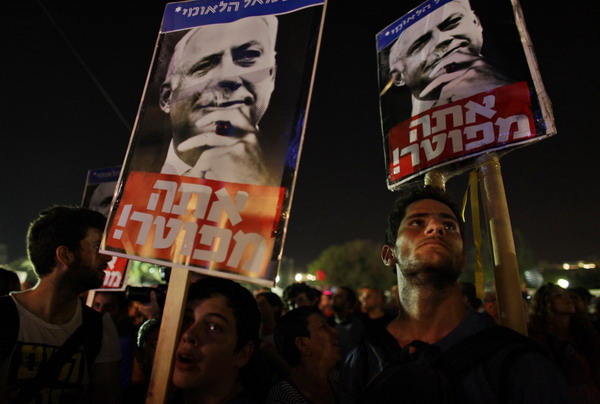 Biggest rally in Israel's history presses PM