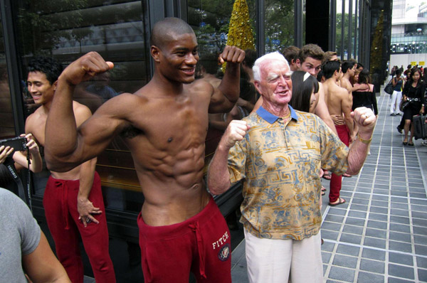 Shirtless men at Singapore's shopping district