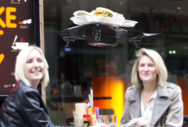 Flying trays keep customers amused