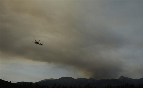 Firefighters hold line against California wildfire