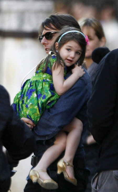 Tom Cruise holds Suri during a break in filming in Seville