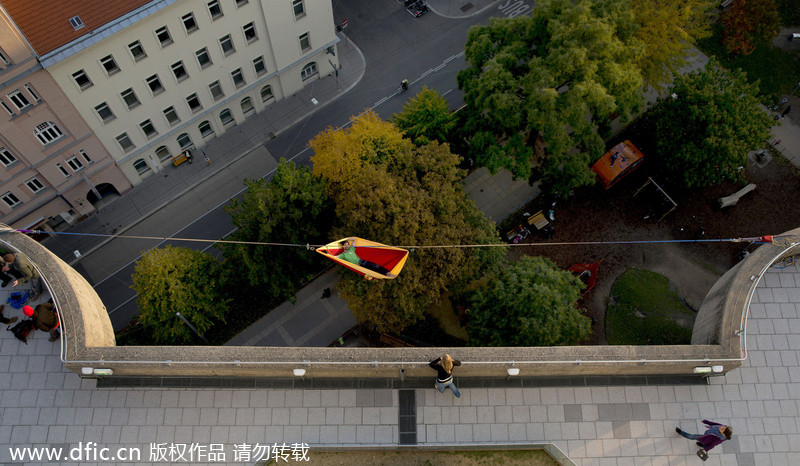 Thrill seeker enjoys hammock in the sky