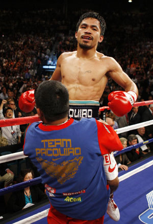 Filipino Pacquiao beats down British boxer