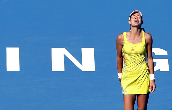 Ivanovic out of China Open, Sharapova cruises through