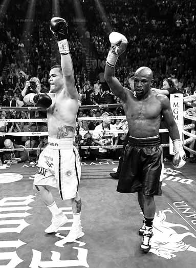 Mayweather gets majority nod over gutsy Maidana