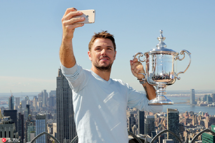 Wawrinka climbs 'top of the rock' for celebration