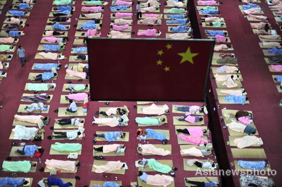 Parents of freshmen students sleep in gym