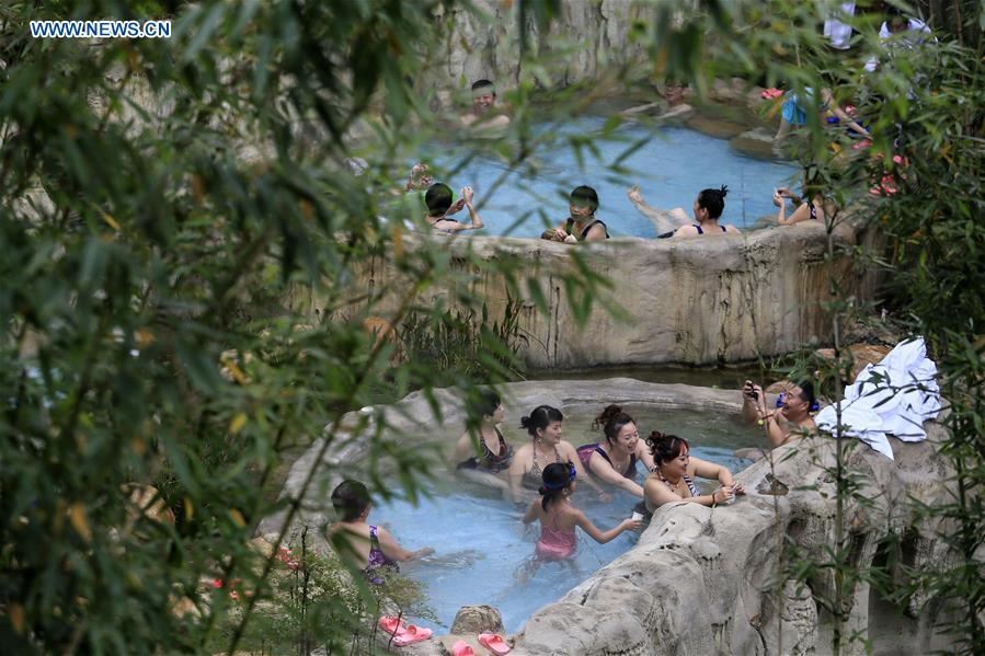 People enjoy hot spring in Hebei