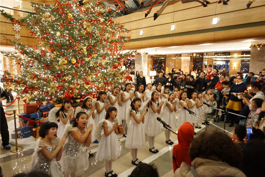 Beijing gets into Christmas spirit with illuminated trees, carols and the smell of cinnamon