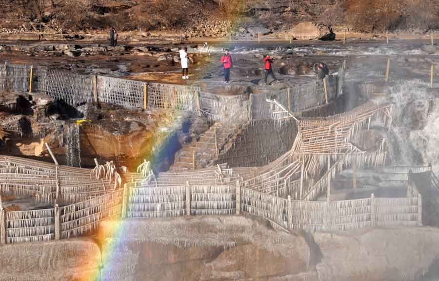 Rainbow arches over Hukou Waterfalls in N China