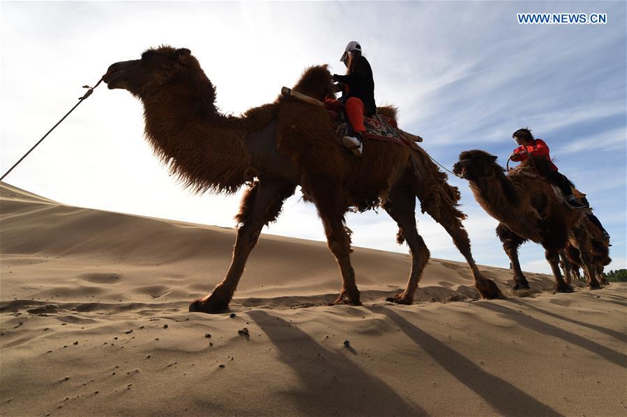 Mingsha Sand Mountain scenery zone in Dunhuang attracts tourists