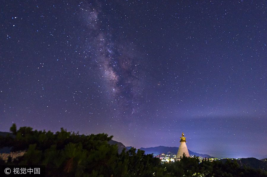 Milky Way illuminates night sky over small town in Jiangxi