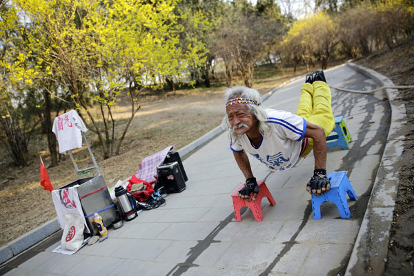 Kung fu grandpa shows off abs