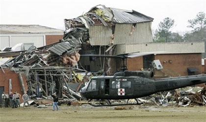 A U.S. Military helicopter evacuates a patient from Enterprise High School after a tornado did severe damage to the school, Thursday March 1, 2007 in Enterprise, Ala. (AP Photo