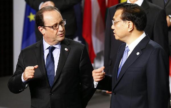 Chinese premier, French president meet on deepening ties