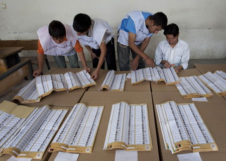 Workers start to count election votes in Afghanistan