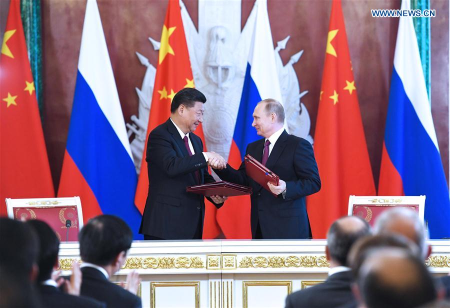 China, Russia pledge to play role of ballast stone for world peace