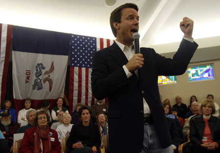 U.S. Democratic Presidential candidate and former Senator John Edwards (D-NC) shakes his fist as he campaigns at the Friendship Haven Celebration Center in Fort Dodge, Iowa January 1, 2008.