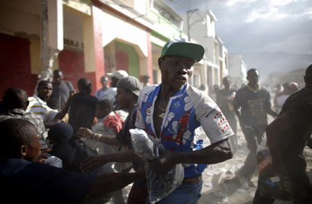 Hunger and hope, thirst and frenzy grip Haiti