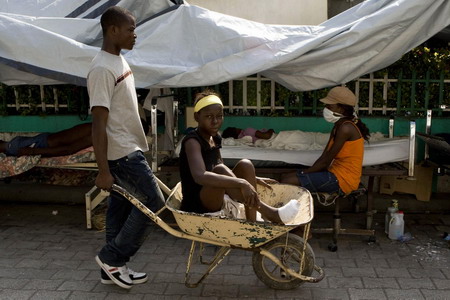 Haitians pray, cry for help in the ruins