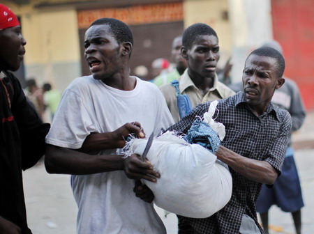 Haitians pray, cry for help in the ruins