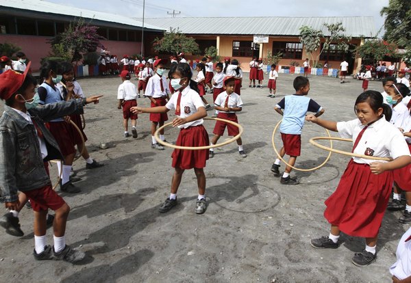 Indonesian volcano erupts, forcing evacuation of hundreds