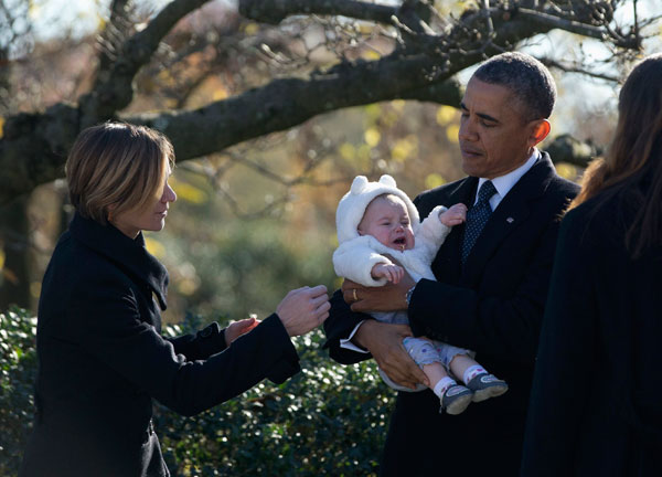 Obamas, Clintons honor Kennedy assassination