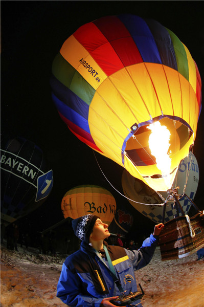 People light up hot air balloons in Germany