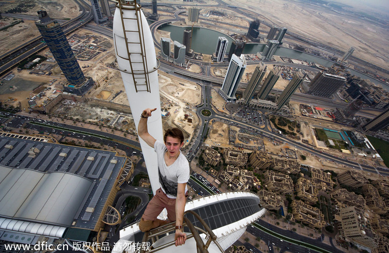 Daredevils taking selfie over Dubai skyscraper