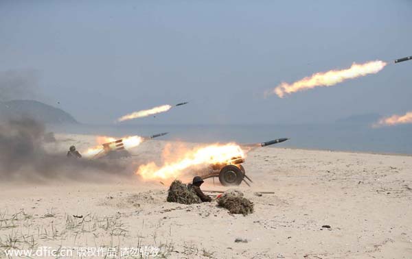 DPRK fires some 100 shells into eastern waters