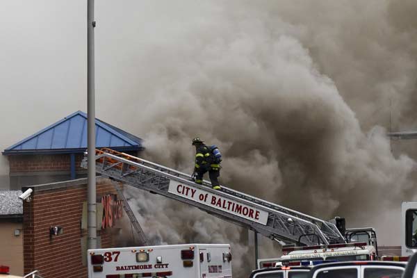 Riot, looting prompt state of emergency, curfew in Baltimore